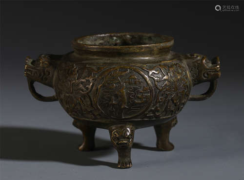 A CHINESE BRONZE CARVED DOUBLE HANDLE TRIPLE FEET CENSER