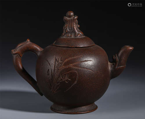 A CHINESE ZISHA CLAY CARVED TEA POT