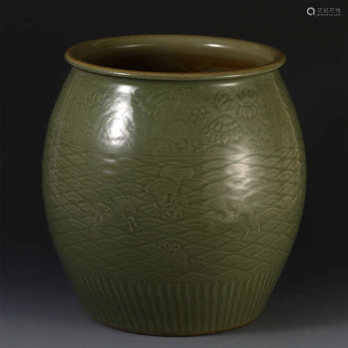 A CHINESE PORCELAIN CELADON GLAZE CARVED JAR