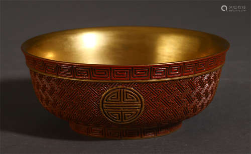 A CHINESE PORCELAIN RED GLAZED CARED SHOU PATTERN BOWL