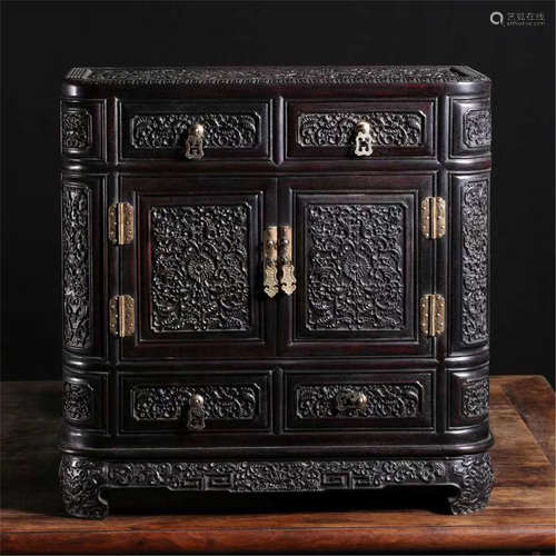 A CHINESE ROSEWOOD RELIEF-DECO DOUBLE DOOR CABINET