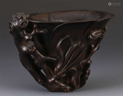 A CHINESE ROSEWOOD CARVED FLOWER LIBATION CUP