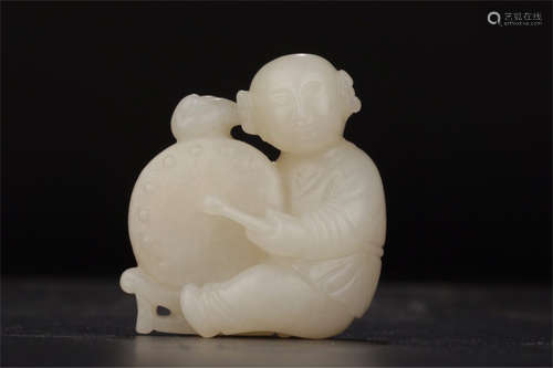 HETIAN JADE CARVED 'CHILD DRUMMER' ORNAMENT