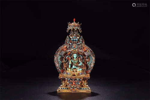 SILVER FILIGREE AND TURQUOISE CARVED 'GREEN TARA' SEATED FIGURE WITH MANDORLA