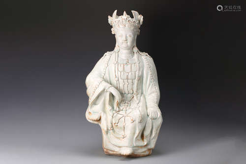 CELADON GLAZED AND CARVED GUANYIN SEATED FIGURE