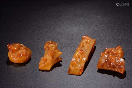 SET OF FOUR ARCHAIC JADE CARVED SWORD ORNAMENTS