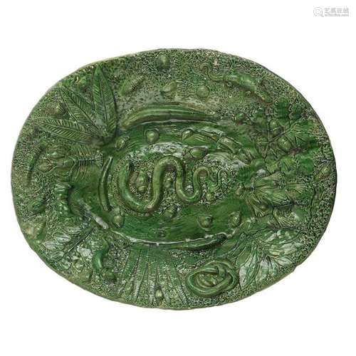 GREEN GLAZED GLAZED EARTH OVAL PLATE, 17th CENTURY with relief decoration of snakes, frogs, lizards, crayfish, shells and foliage.