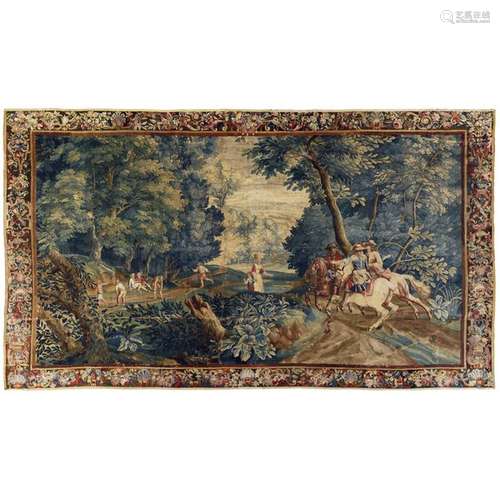 HALTE DE CAVALIERS ET VILLAGEOIS SOUS LES FRONDAISONSTAPISSERIE, BRUSSELS, BEGINNING OF THE XVIIIth CENTURY Wool and silk. With its brown background border of garlands of flowers, foliage, fruits and shells.