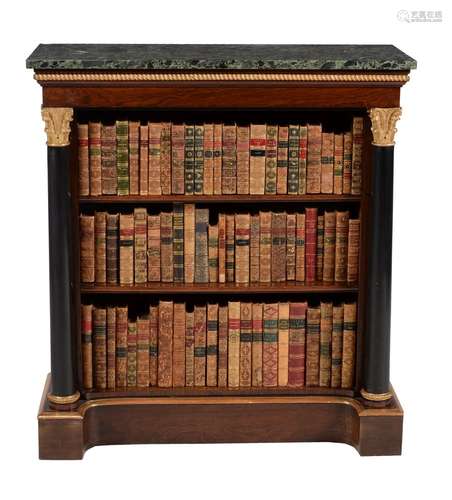 A pair of Regency parcel gilt and rosewood open bookcases, circa 1815