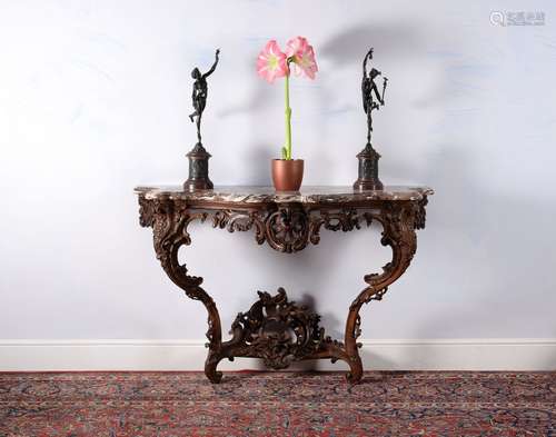 A Louis XV carved oak console table, circa 1735