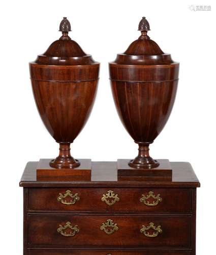 A pair of mahogany and boxwood strung cutlery urns, in George III style, late 19th/ early 20th centu