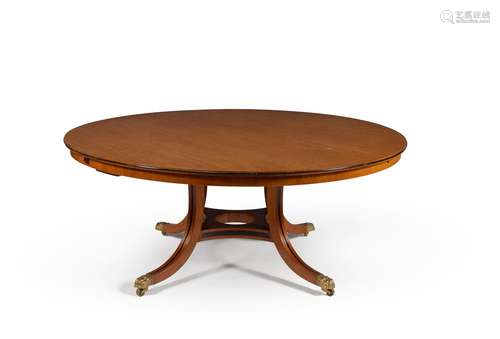 A mahogany and ebonised extending circular dining table, by William Tillman, 20th century