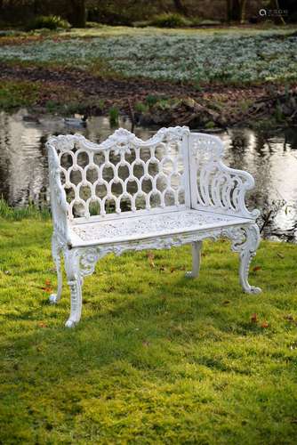 A white painted cast iron 'rose garden pattern' garden seat to a model by Carron & Co