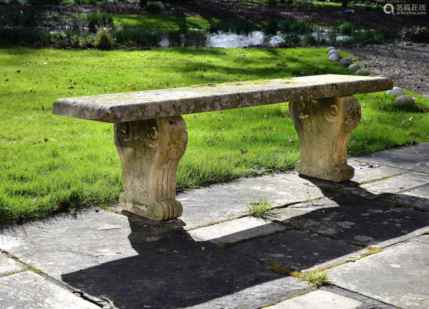 aregencycarvedstonegardenbench