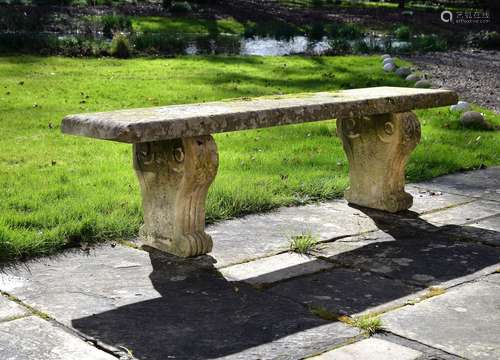 A Regency carved stone garden bench