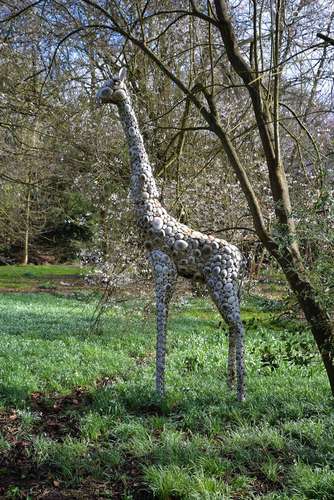 A large patinated metal garden model of a standing giraffe, late 20th century