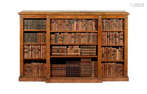 A Victorian walnut, figured burr walnut and gilt metal mounted breakfront bookcase, circa 1860