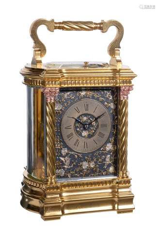 A fine French gilt brass carriage bow-sided clock with multi-coloured relief cast foliate decorated