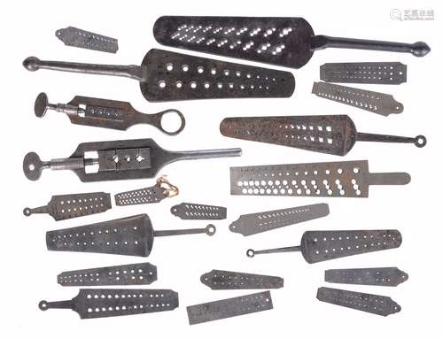 A collection of nineteen clock and watchmaker’s screwplates, various makers, mid 19th century and la