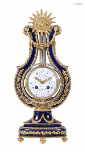 A French Louis XV style ormolu mounted Sevres style bleu do roi porcelain lyre mantel clock, the dia