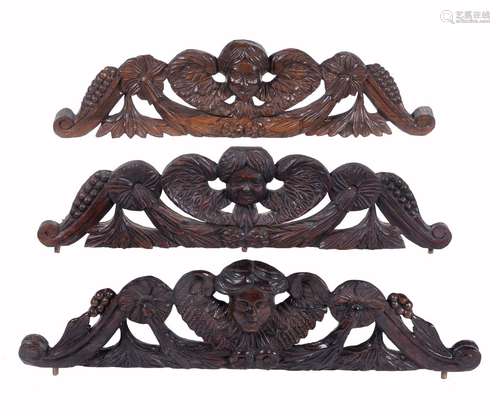 Three carved wood longcase clock pediment crest ornaments, for use in the restoration of longcase cl