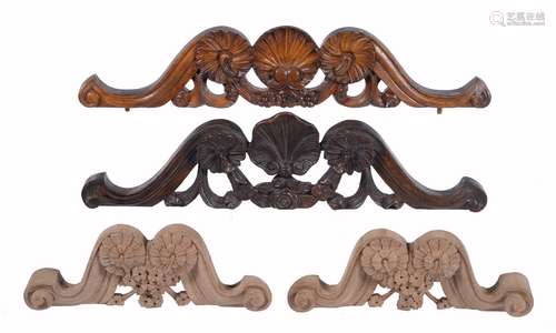 Two carved wood longcase clock pediment crest ornaments, for use in the restoration of longcase cloc