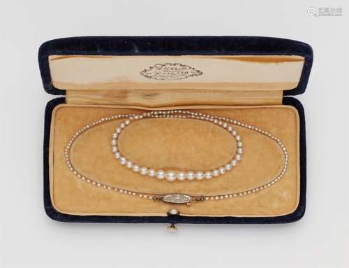 A Belle Epoque pearl necklace with original caseA graduated strand of 165 pearls (presumably