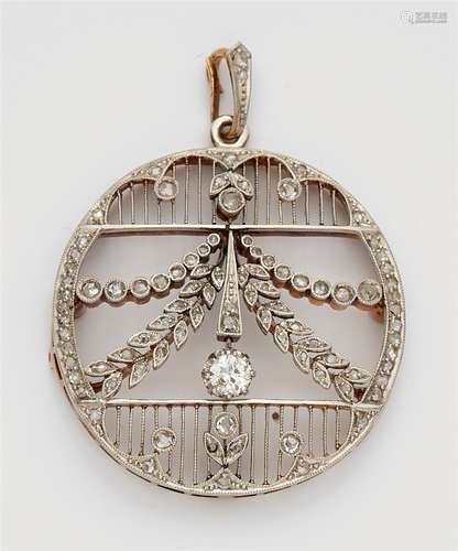 A Belle Epoque 14k gold and diamond pendantPlatinum and 14k gold pendant designed as a delicately