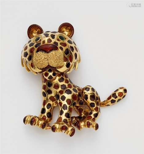 An 18k gold and enamel leopard brooch18k gold brooch designed as a sitting leopard cub picked out in