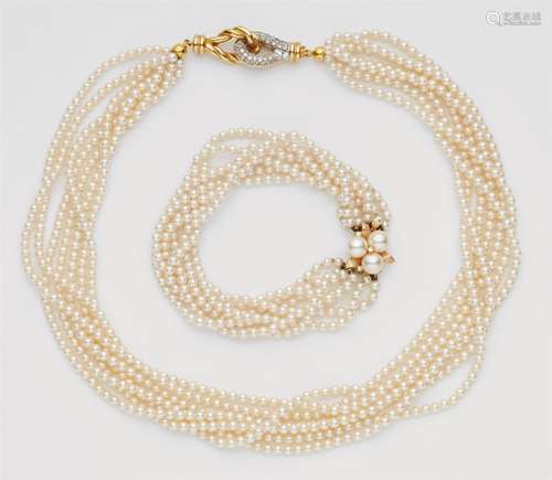 A gold and cultured pearl necklace and bracelet18k and 14k gold pieces, the necklace formed from