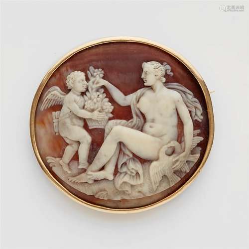 An 18k gold and shell cameo brooch with Venus and CupidA thick, round sea snail cameo carved with