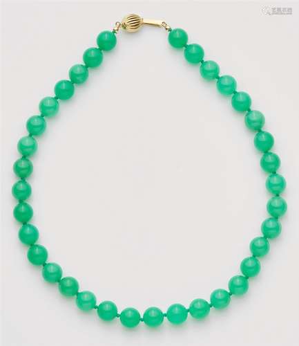 A 14k gold and chrysoprase necklace and pair of earrings14k gold, the pendant 18k gold. Comprising a