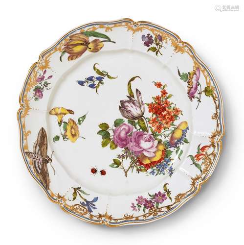 A Nymphenburg porcelain plate related to the court serviceScalloped plate with thick, moulded rim.