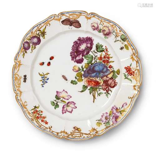 A Nymphenburg porcelain plate related to the court serviceScalloped plate with thick, moulded rim.