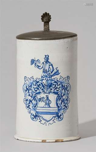 A South German heraldic faience tankardDecorated in blue and white with a large family coat of