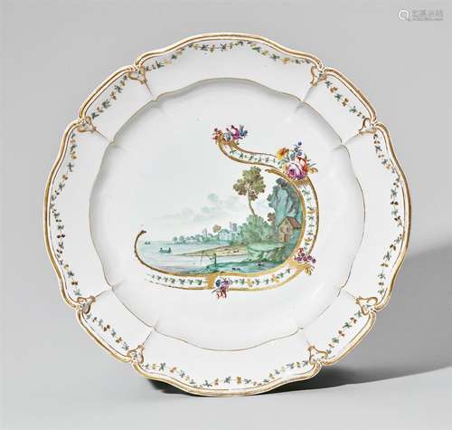 A large Nymphenburg porcelain platter with a green landscapeRound, scalloped platter with a slightly