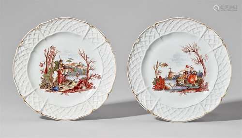 A pair of Nymphenburg porcelain plates with peasant scenesOf scalloped form with basket weave