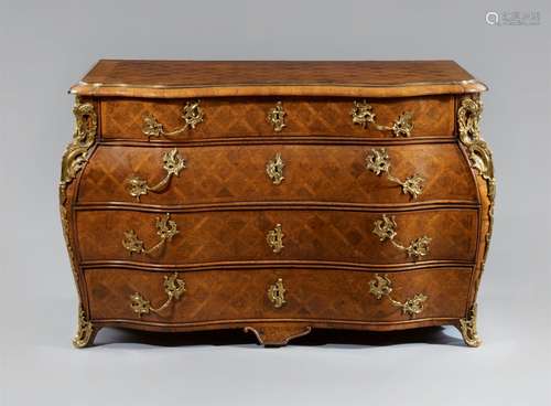 A bombé form chest of drawersA walnut veneered cabinet with replaced bronze and brass mountings