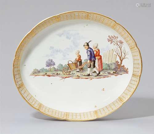 An oval Nymphenburg porcelain dish with a peasant sceneGilt-rimmed dish painted with a depiction