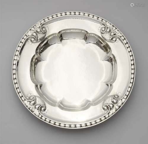 A silver fruit bowl by Georg Jensen, model no. 320Deep round dish, the flaring rim decorated with