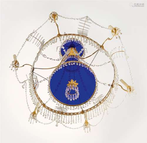 A Neoclassical chandelierOrmolu chandelier with cut glass droplets and blue glass panes. Six