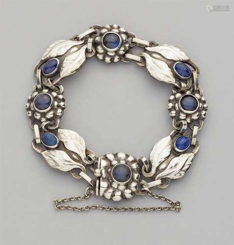 A Jugendstil silver bracelet by Georg Jensen, model no. 3A strand of stylised flower and leaf shaped