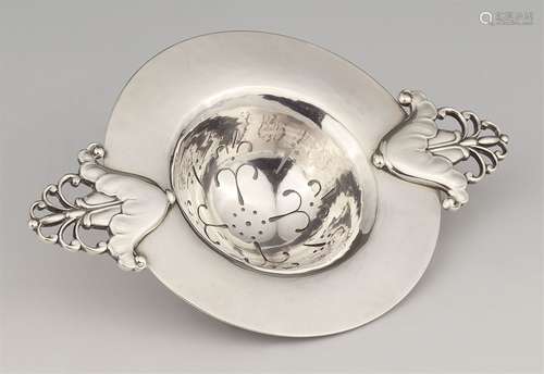 A silver tea strainer by Georg Jensen, model no. 117A semi-spherical tea strainer with pierced décor