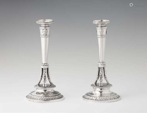 A pair of Empire silver candlesticksSilver. Column shaped candlesticks on hoof feet. Marks: