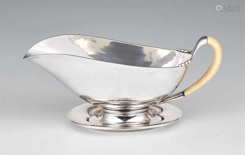 A Copenhagen Art Deco silver sauce boat by Evald NielsenDeep oval sauce boat with an ivory handle on