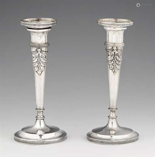 A pair of Würzburg silver candlesticksSilver. Tapering column shafts with acanthus relief