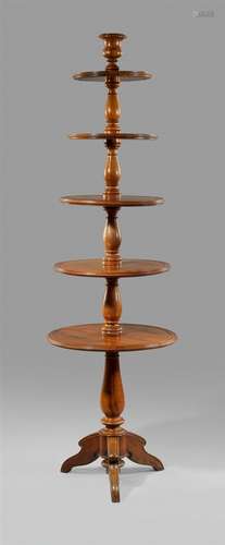 A French etagère or “serviteur muet”Nuss massiv. Solid walnut piece comprising a central screw-