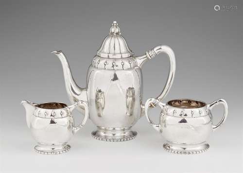 A Copenhagen Art Déco silver coffee serviceComprising a coffee pot, milk jug, and sugar box. With