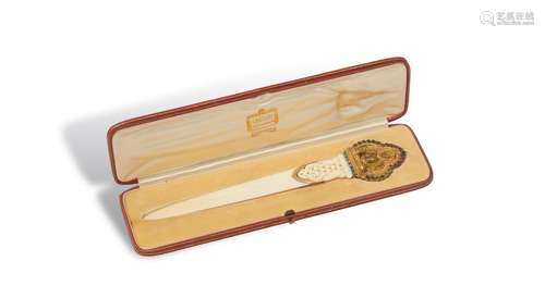 An Art Deco silver letter openerCarved ivory letter opener, the terminal pierced and with a design