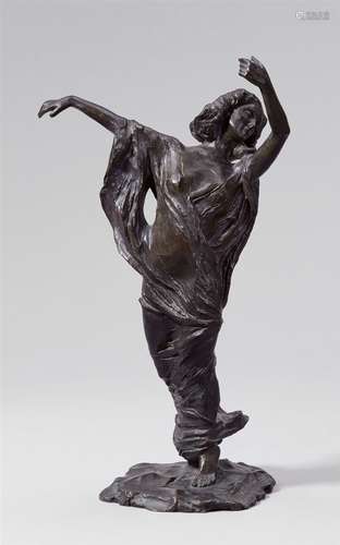 A bronze figure of a veil dancerCast bronze with dark brown patina. Signed at the base of the plinth